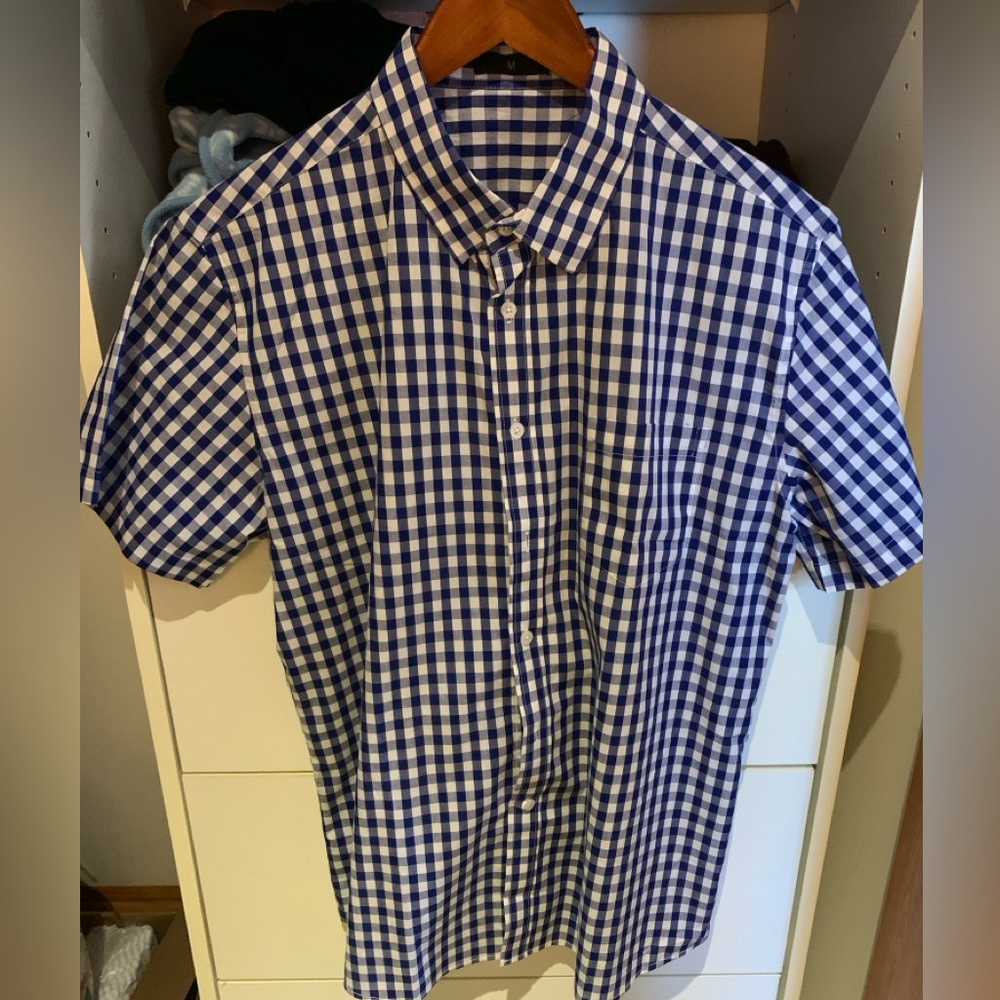 Blue and white checkered, short sleeve, button up shirt.
Size medium.